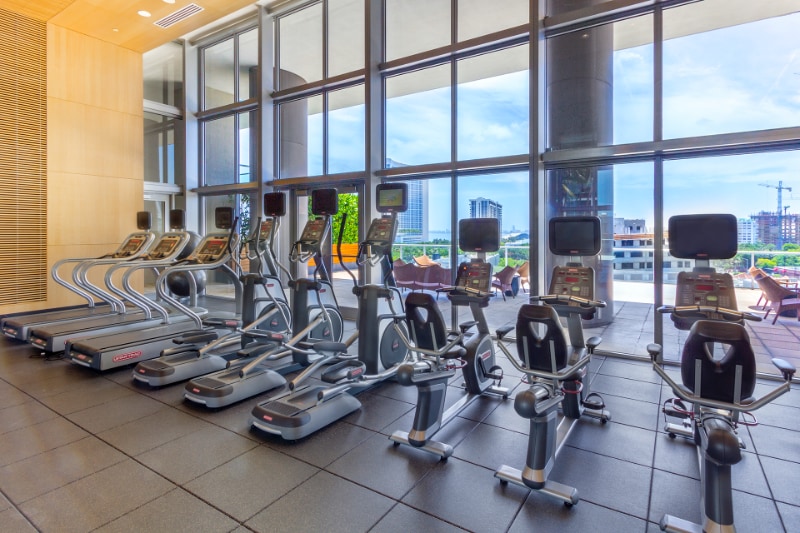 State-of-the-art fitness center with cardio equipment and panoramic windows